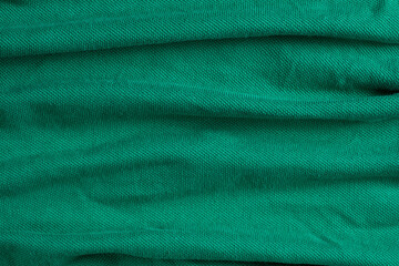 Close-Up of Abstract Green Emerald Cotton Textile Surface Top View
