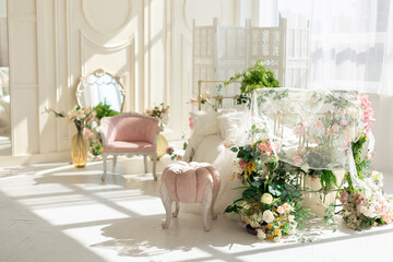 luxury delicate vintage white bedroom with metal bed and pillows and linen in classic style. Shabby chic interior girly or provencal style with pink pouffe. Wedding interior room. Princess design room