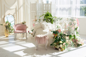 luxury delicate vintage white bedroom with metal bed and pillows and linen in classic style. Shabby chic interior girly or provencal style with pink pouffe. Wedding interior room. Princess design room