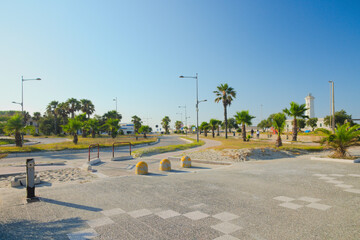 Touristical square with palm trees near San Cataldo beach, in Salento, Lecce, Apulia  Region, Italy