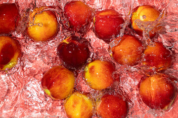Vibrant Peaches in Water with Splash. Summer Fruit Scene.
