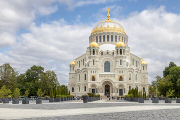 Kronstadt, Russia 06.30.2025 - Naval Cathedral in Kronstadt, Russia, with golden domes under cloudy sky
