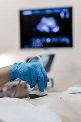 Ultrasound examination during pregnancy consultation at medical clinic. Concept pregnancy diagnostics and maternal healthcare