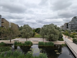 Fototapeta premium Overview of buildings along Martin Luther King Park in Paris 7th Arrondissement, France - June 2025