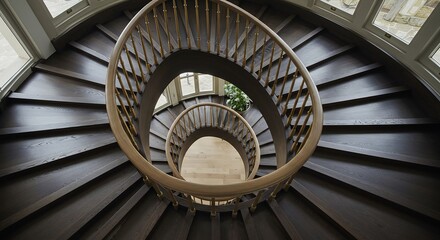 Fototapeta premium Elegant Dark Wood Spiral Staircase with Brass Accents and Natural Light
