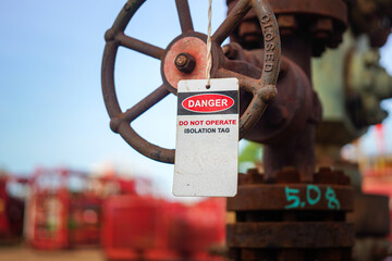 Isolation tag or lockout tagout which is hanged on pipeline valve that under maintenance, do not...
