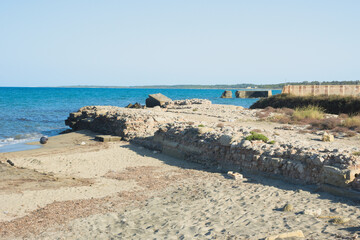 Archaeological site with ruins of the ancient Roman port. San Cataldo coast, Lecce, Apulia Region,...