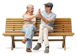 Happy mature couple sitting on a wooden bench, embracing and smiling with joy. A cheerful and...