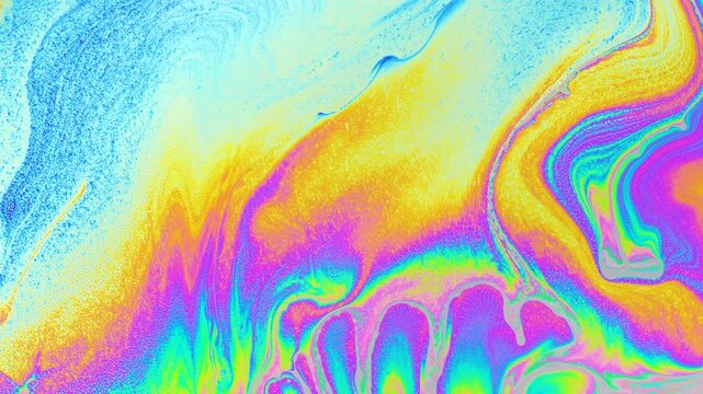 Macro photo of vibrant soap bubble texture with swirling rainbow hues and fluid abstract patterns in bright iridescent tones