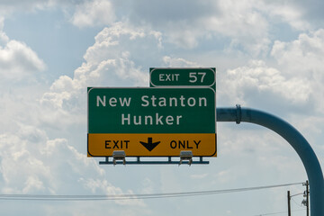 sign for Exit 57 from I-70 for New Stanton and Hunker, PA