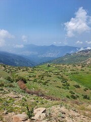 mountain landscape with blue sky and clouds