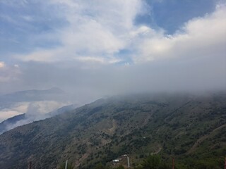 Naklejka premium clouds over the mountains