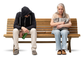 Scared mature woman sitting on a bench, clutching her handbag tightly. Next to her sits a...