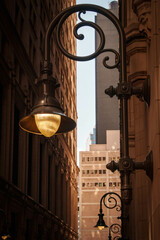 New York City street landscape along Wall Street and Broadway in the Financial District of Lower Manhattan, NYC