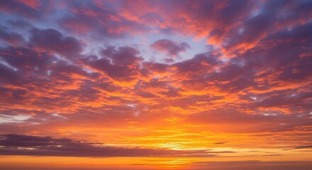 Fototapeta premium Vibrant Sunset Sky with Layered Clouds