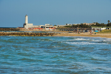 Touristic facilities and the lighthouse of San Cataldo coast, in Salento. Lecce, Apulia Region,...