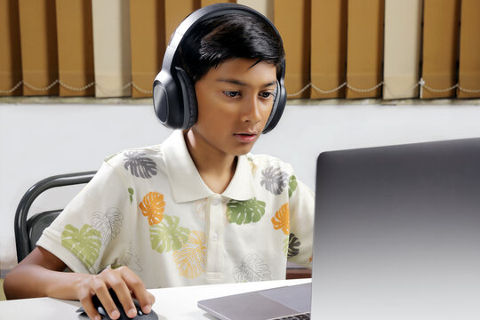 Indian young boy listening to music with headphones or student, school boy online studding on laptop
- Powered by Adobe