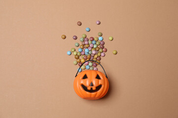 Halloween with orange pumpkins, black bats, autumn leaves on beige background
