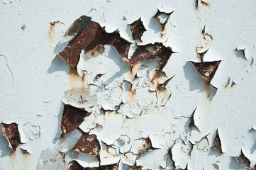 old peeling paint on metal wall close up