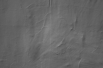 gray background, photo shows texture of plaster on wall of building
