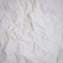 Obraz premium Abstract textured background of crumpled white paper with soft lighting