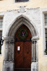 Medieval Stone Archway Entrance with Wine Glass Wreath in Tallinn Old Town