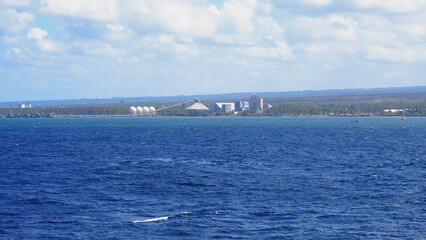 Blue ocean and an island photographed from a ship
