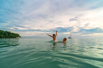Children having fun in the sea