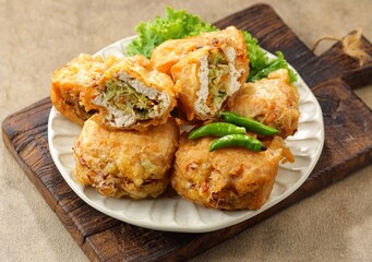 Tahu Isi. Stuffed tofu is known as fried food in the form of brown tofu filled with various fillings.