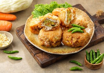 Tahu Isi. Stuffed tofu is known as fried food in the form of brown tofu filled with various fillings.