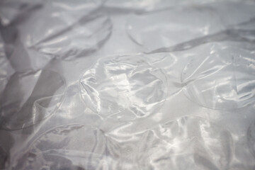Extreme macro of plastic bubble wrap texture. Selective soft focus, shallow depth of field. Abstract dreamy background