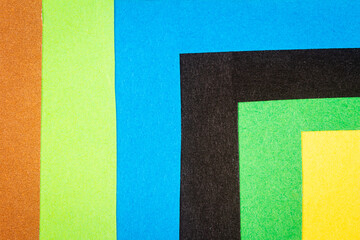 Multi color background from a paper of different colors. Abstract colorful vibrant textures paper.