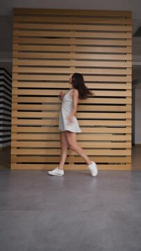 A talented female artist performs a contemporary dance, telling a dramatic story through her body language. This is a form of performance art, an emotional monologue expressed via movement and acting.