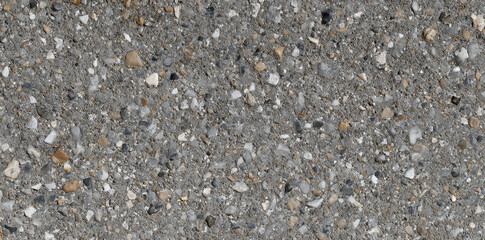 Exploring the subtle beauty of a seamless concrete texture featuring sand and small stones against a gray backdrop that enhances visual depth