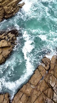 Aerial view of the surf in Mousehole, Cornwall, England, United Kingdom