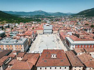Italy, July 4, 2025: Panoramic aerial view, from the drone, of the Piazza del Duomo in L'Aquila in Abruzzo. Here you can breathe peace and tranquility and history.