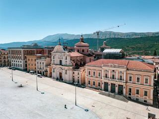 Italy, July 4, 2025: Panoramic aerial view, from the drone, of the Piazza del Duomo in L'Aquila in Abruzzo. Here you can breathe peace and tranquility and history.