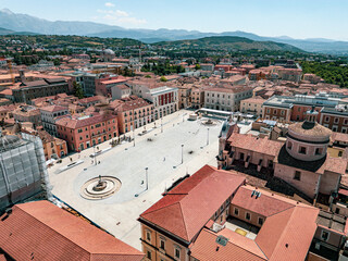 Italy, July 4, 2025: Panoramic aerial view, from the drone, of the Piazza del Duomo in L'Aquila in...