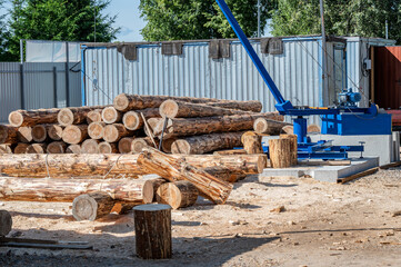 A pile of pine logs at a construction site.