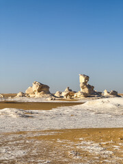 White rock formations and sand dunes in Egypt's White Desert, natural desert landscape	