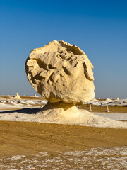 White rock formations and sand dunes in Egypt's White Desert, natural desert landscape	