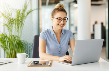 Happy Female Employee Working Remotely in Stylish Office