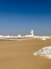 White rock formations and sand dunes in Egypt's White Desert, natural desert landscape	