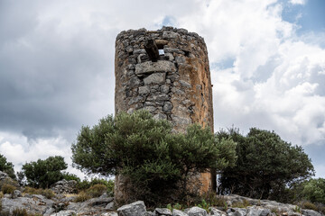 ancient Greek mills against a Mediterranean landscape on the island of Crete