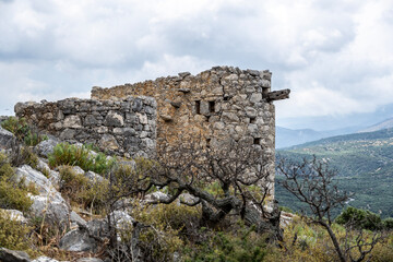 ancient Greek mills against a Mediterranean landscape on the island of Crete