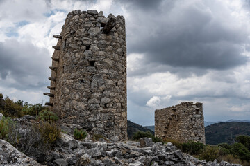 ancient Greek mills against a Mediterranean landscape on the island of Crete