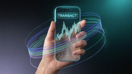 Hand holding transparent smartphone displaying financial chart and transact button
