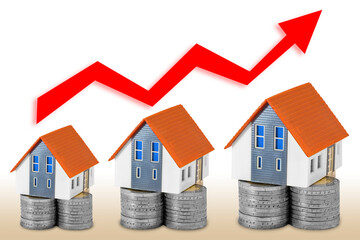 REAL ESTATE MARKET TRENDS - Concept with home models and increasing graph