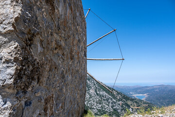 ancient Greek mills against a Mediterranean landscape on the island of Crete