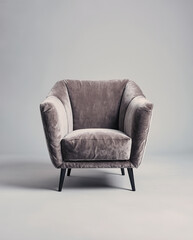 Contemporary Grey Velvet Armchair with Rounded Back and Black Metal Legs, Cozy Minimalist Lounge Chair on Soft Grey Background